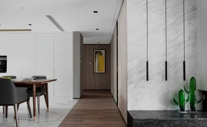 Modern dining room featuring marble elements and minimalist design.