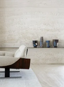 A modern minimalist interior design featuring concrete and wood materials