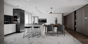Modern residential kitchen with marble countertops and white walls