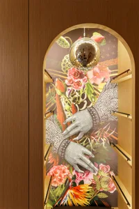A vibrant, floral-themed wall mural featuring a disco ball and decorative elements.