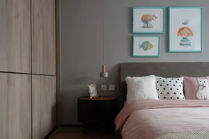 Modern, minimalist bedroom featuring a bed with a wooden headboard and pink bedding, accompanied by a black nightstand and a 