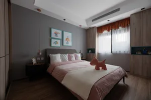 A minimalist bedroom with mixed materials, featuring gray walls, wooden floors, and a bed with pink and white bedding.