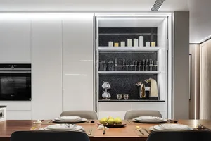 Modern kitchen with polished concrete countertops, marble backsplash and stainless steel appliances