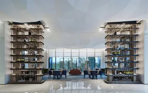 A modern lobby featuring geometric design elements, glass, metal, and marble finishes.