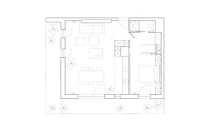 A modern interior design layout depicted in a black and white floor plan, showing a living area, kitchen, and bedroom.