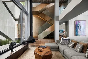 Modern living room with wooden furniture and concrete walls