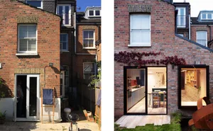 A renovated brick house facade with modern additions and greenery.