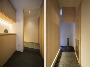 Modern interior design featuring a contemporary entryway with a wooden floor and minimalist aesthetic.