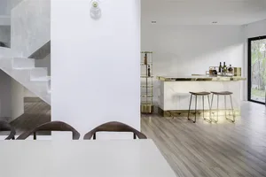 A modern minimalist dining room featuring concrete and marble materials, with a white dining table and wooden chairs.