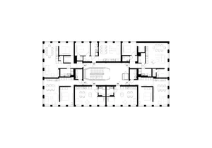 Floor plan of an office layout showing various rooms and areas such as conference rooms, offices, restrooms, and hallways.
