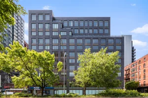 Modern apartment building with brick exterior.