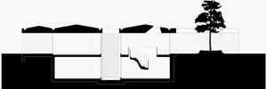 Modern house architecture section view showing floor layout and structural elements.