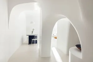 Modern interior space with white walls and concrete floor.