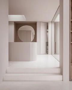現代簡約室內空間，鋪設白色水磨石地板，並搭配乾淨的白色牆面。