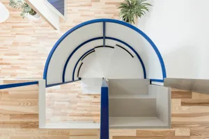 A modern, open-space staircase with a wood floor and white structures.