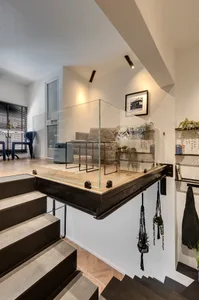 Industrial-style living area featuring concrete flooring and minimalist furniture.