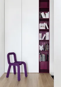 A minimalist bookshelf with purple accents and wood finish.