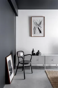 A modern living room interior featuring concrete furniture