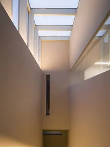 Modern interior design featuring a corridor ceiling with glass windows
