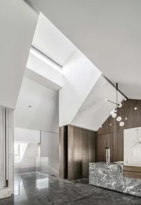A modern interior design featuring marble and metal materials.