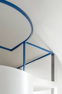A modern interior design featuring metal framing and minimalist aesthetics.