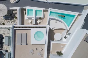 Modern pool terrace featuring concrete tiles and distinct geometric shapes.