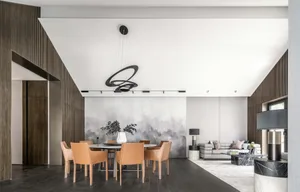 Modern living and dining room with minimalist decor, hardwood floors, and contemporary furniture.
