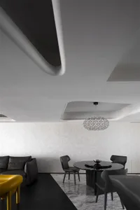 Modern minimalist black and white interior with metal and glass materials.
