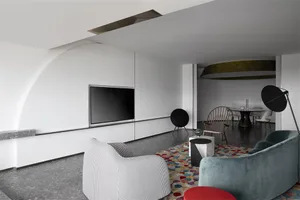 A modern living room with white walls, a black flat-screen TV, and a colorful rug.