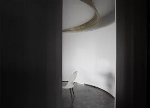 A minimalist modern office space featuring sandwich panels and concrete floor