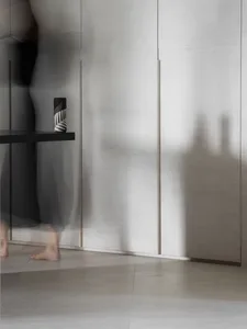 A minimalist interior with monochromatic color scheme and modern materials.