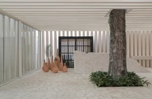 Modern interior space with concrete elements and minimalist design.