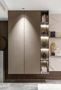 A modern living room featuring metallic cabinets, glass objects, and marble shelves.