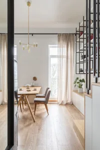 A minimalist residential interior featuring wooden furniture with a modern, clean design.