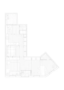 A black and white architectural drawing of an L-shaped floor plan with concrete features.