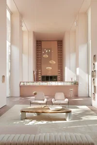 Modern living room with neutral tones and minimalist furniture.