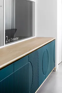 Modern sideboard featuring a wooden surface and glass panels