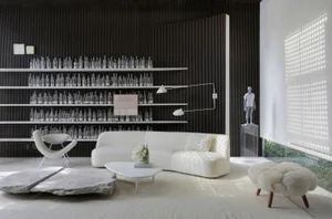 Modern living room featuring white marble and concrete elements and a minimalist style.