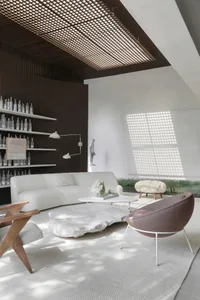 A modern living room featuring a white sofa, stone coffee table, and various lighting elements.