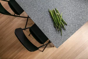 A bunch of asparagus on a speckled granite countertop