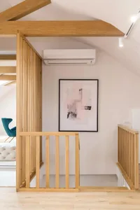 A minimalist interior design featuring a wooden staircase.