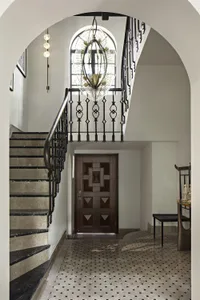 Entrance hall with marble stairs and flooring.