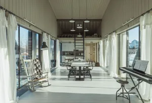 Modern interior design featuring a living room with wood and glass materials.