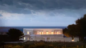 Modern minimalist house with stone exteriors at dusk