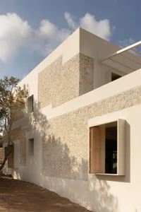 Modern exterior of a building featuring concrete and stone materials