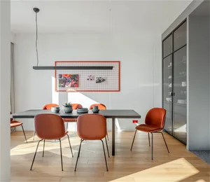 Minimalist dining room with a modern table and chairs