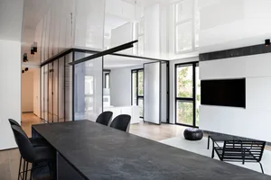 Modern living room featuring a concrete table and minimalist design elements.