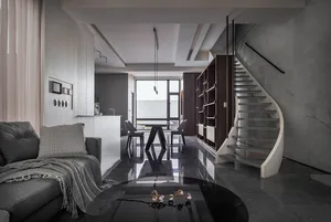 A stylish modern interior featuring a black concrete floor, metal accents, and a sleek furniture arrangement including a larg