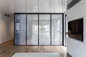 A modern minimalist room divider made of glass, featuring clean lines and a sleek design.