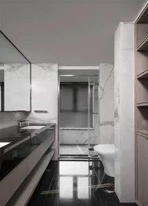 Modern bathroom with marble walls and black tile floor